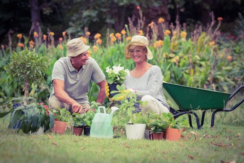 Professional gardener working in a Highgate front garden next to a terrace house
